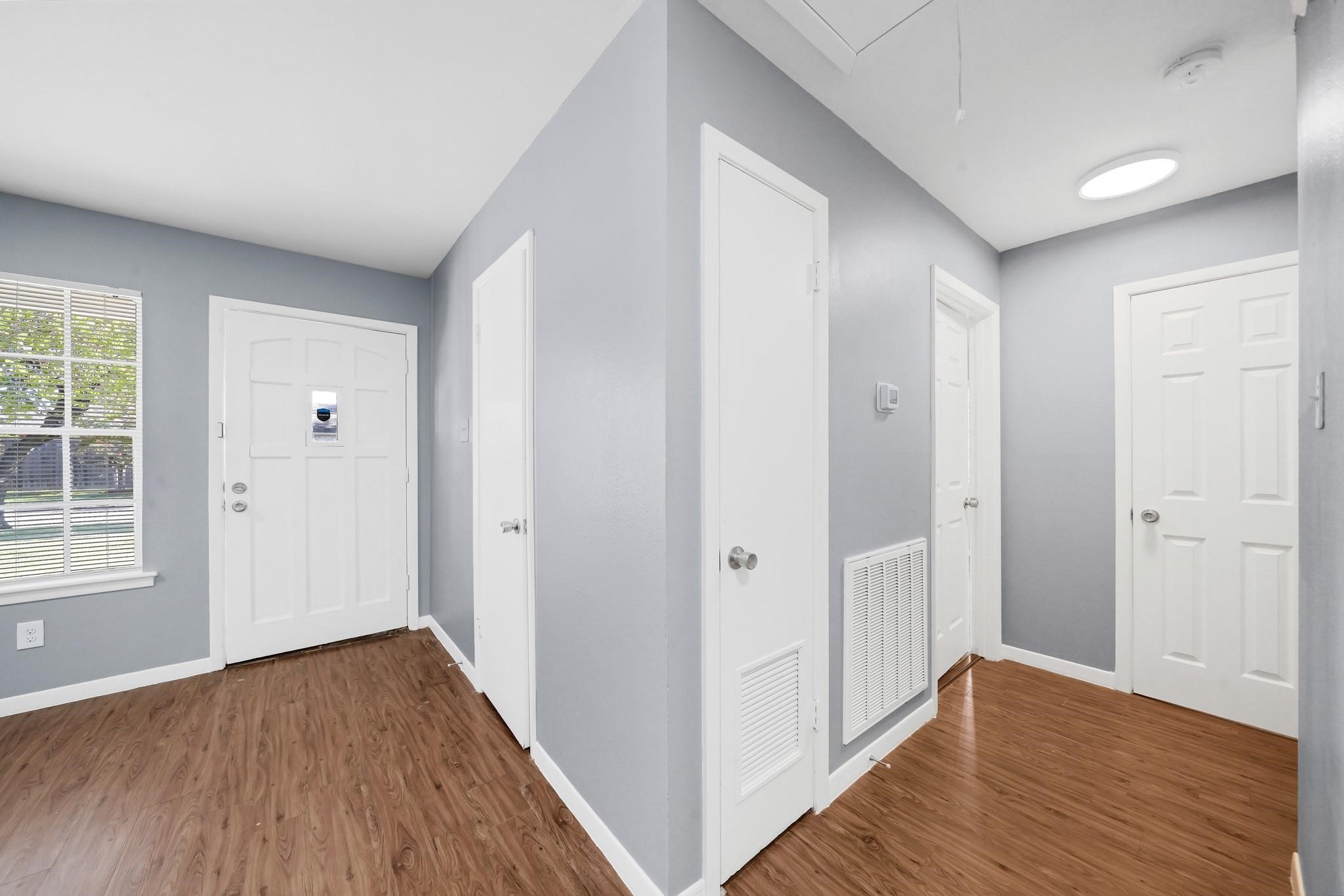 11202 Waxwing Street Houston, TX 77035 - Photo 8 of 19 a view of hallway with wooden floor