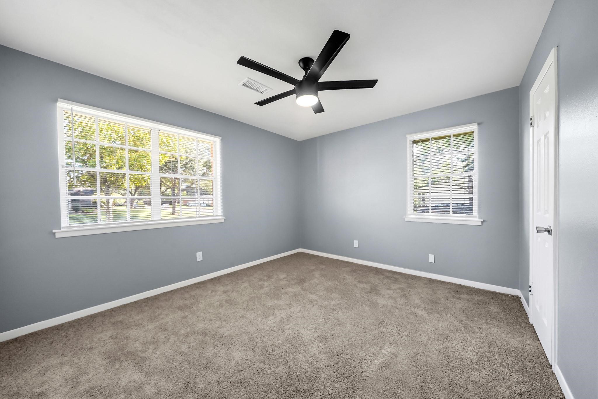 11202 Waxwing Street Houston, TX 77035 - Photo 9 of 19 a view of an empty room with a window