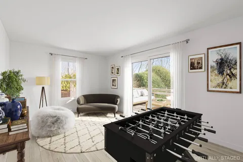 a bedroom with furniture and a window