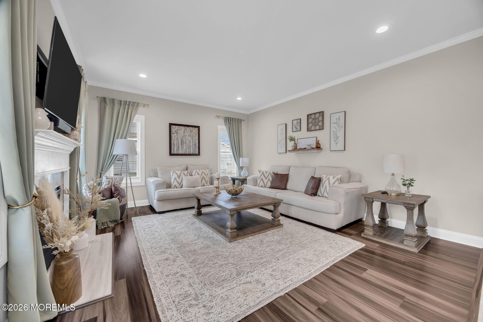 10 Tasha Lane Howell, NJ 07731 - Photo 15 of 44 a living room with fireplace furniture and a flat screen tv