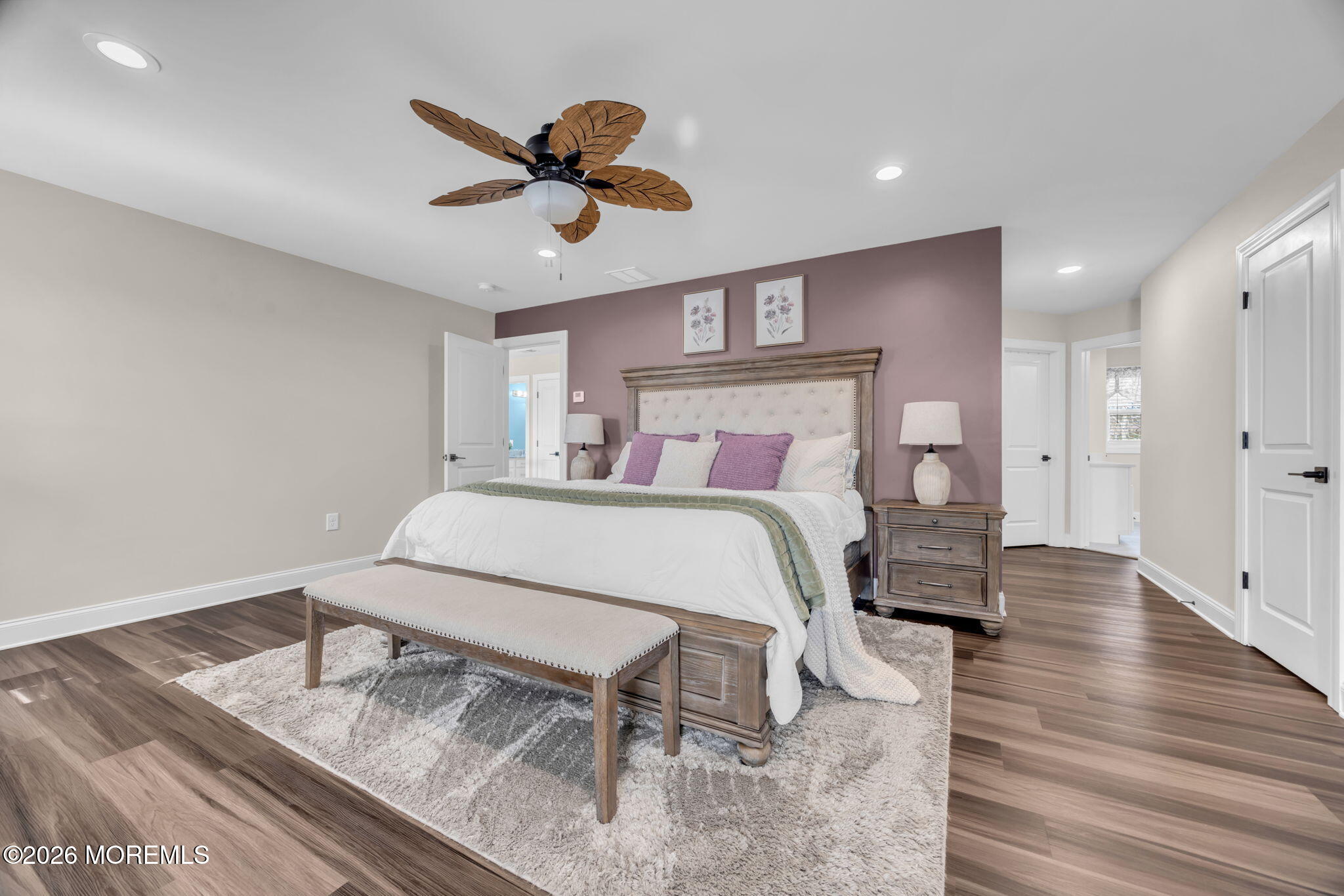 10 Tasha Lane Howell, NJ 07731 - Photo 16 of 44 a bedroom with a bed and a chandelier