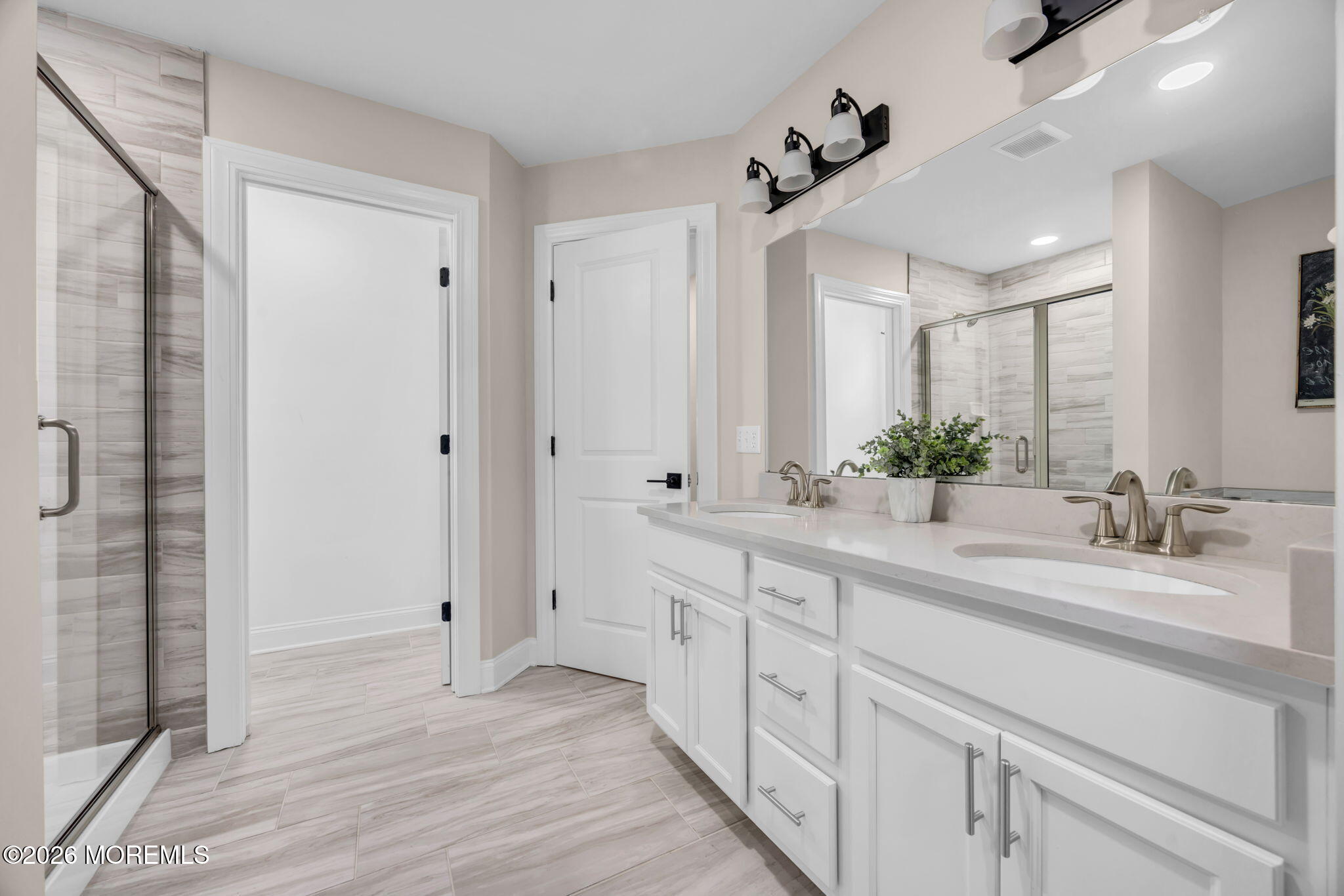10 Tasha Lane Howell, NJ 07731 - Photo 18 of 44 a bathroom with a double vanity sink and a mirror