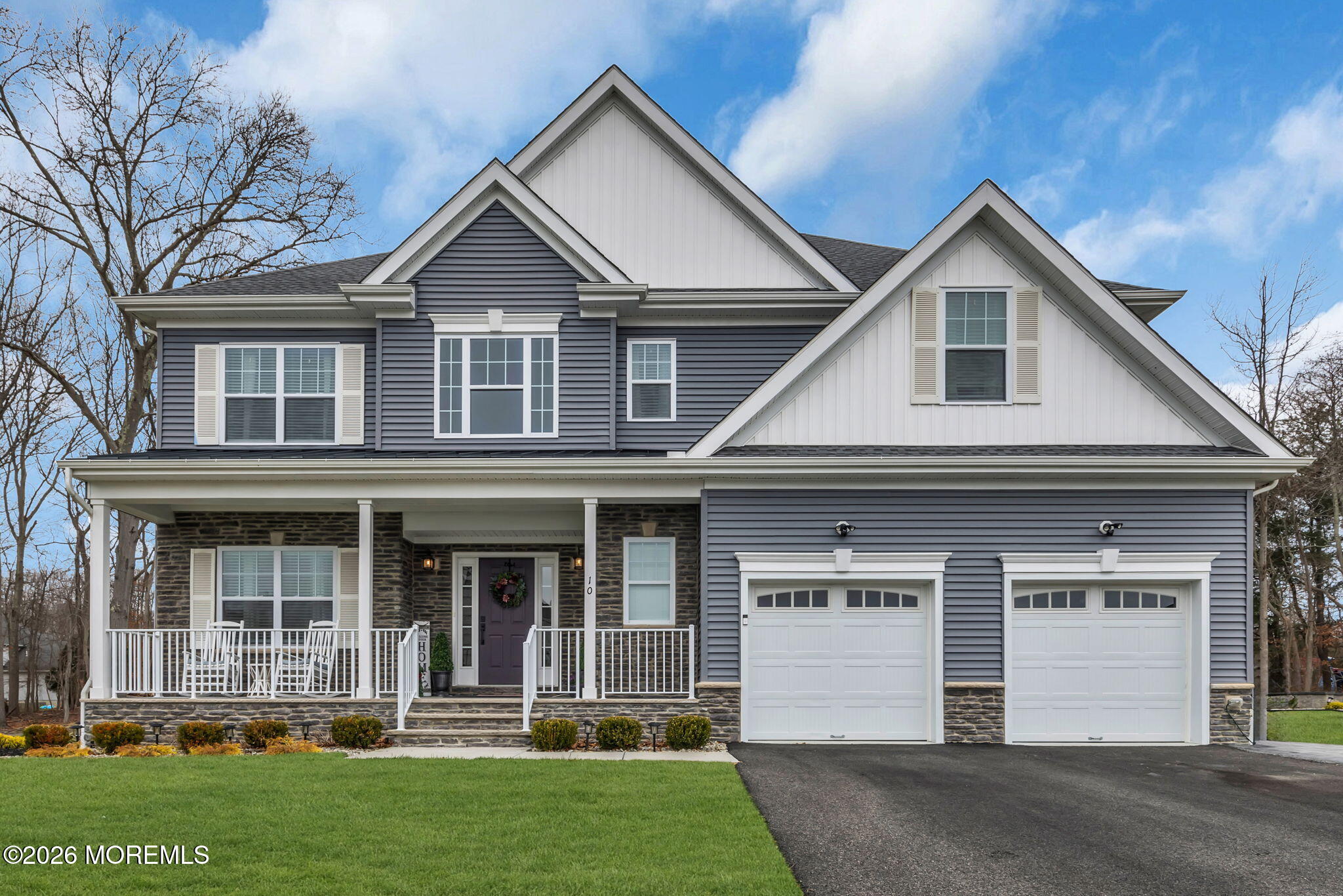 10 Tasha Lane Howell, NJ 07731 - Photo 23 of 44 a front view of a house with a yard and garage