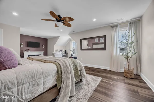 a bedroom with double bed and a window