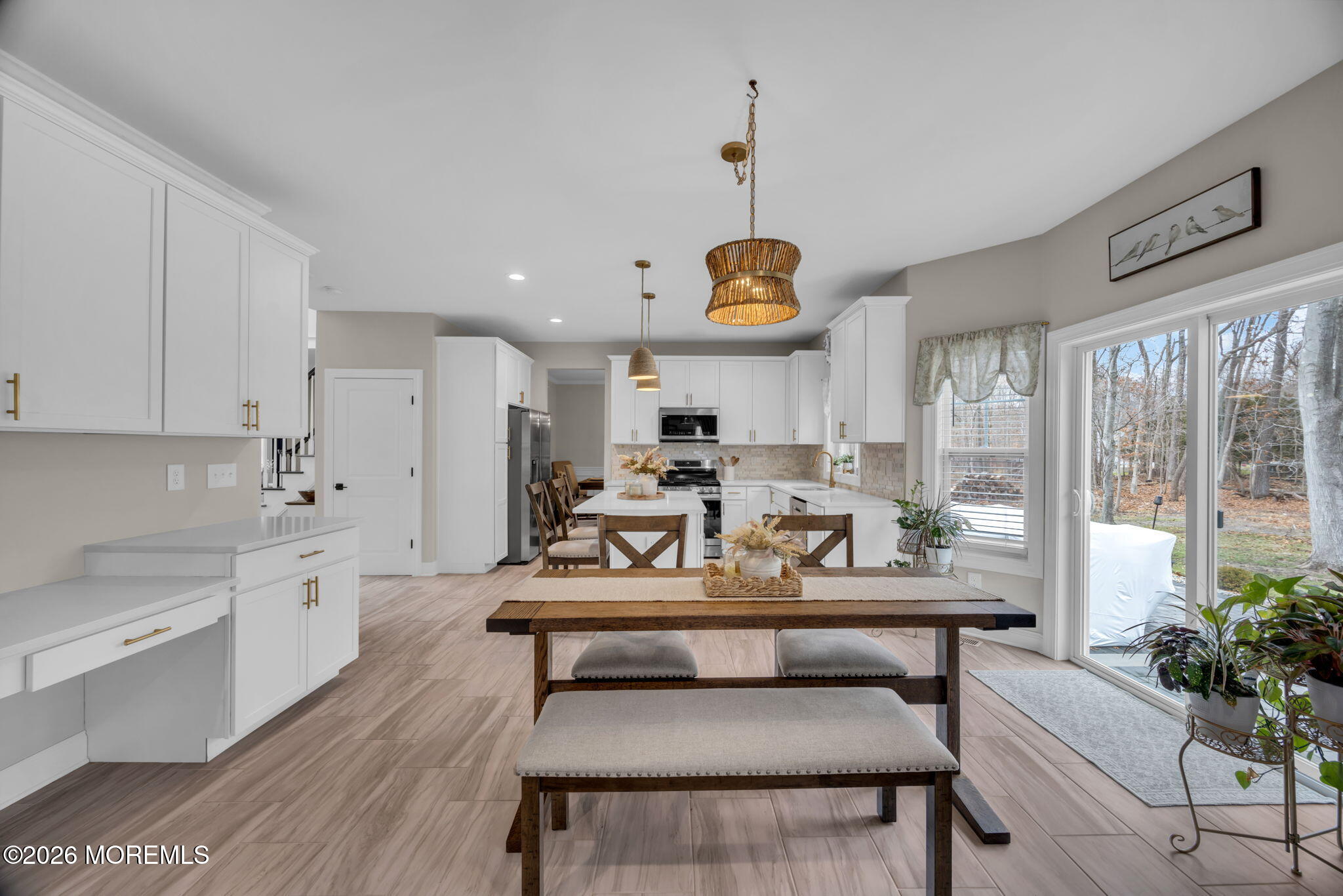 10 Tasha Lane Howell, NJ 07731 - Photo 30 of 44 a living room with stainless steel appliances kitchen island granite countertop furniture and a wooden floor