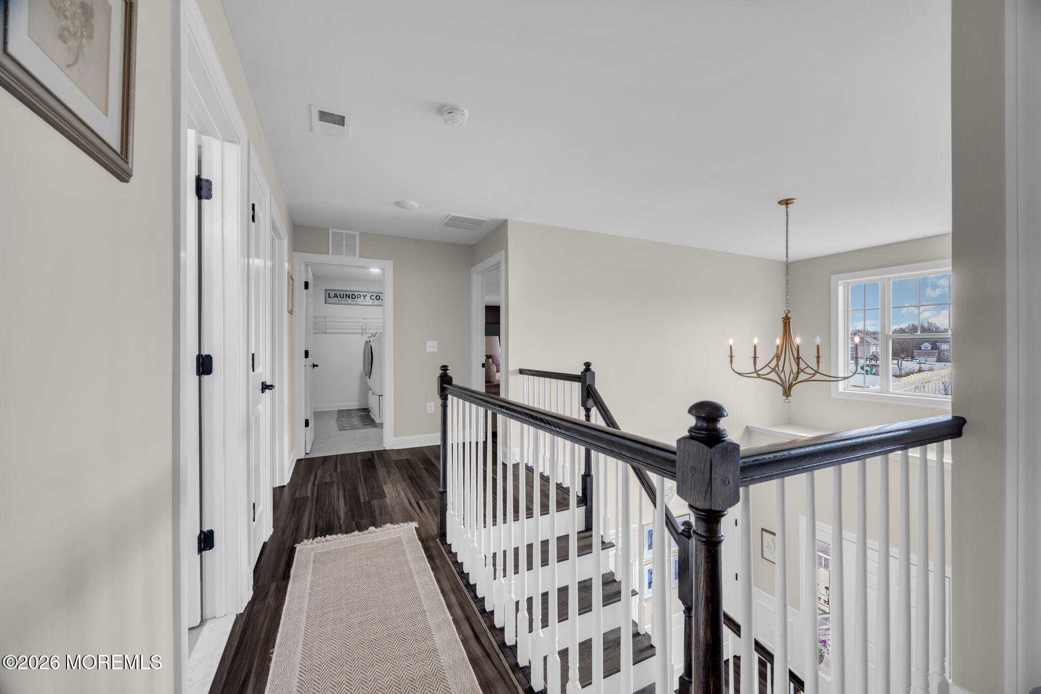 10 Tasha Lane Howell, NJ 07731 - Photo 32 of 44 a view of a hallway with a hardwood floor and stairs