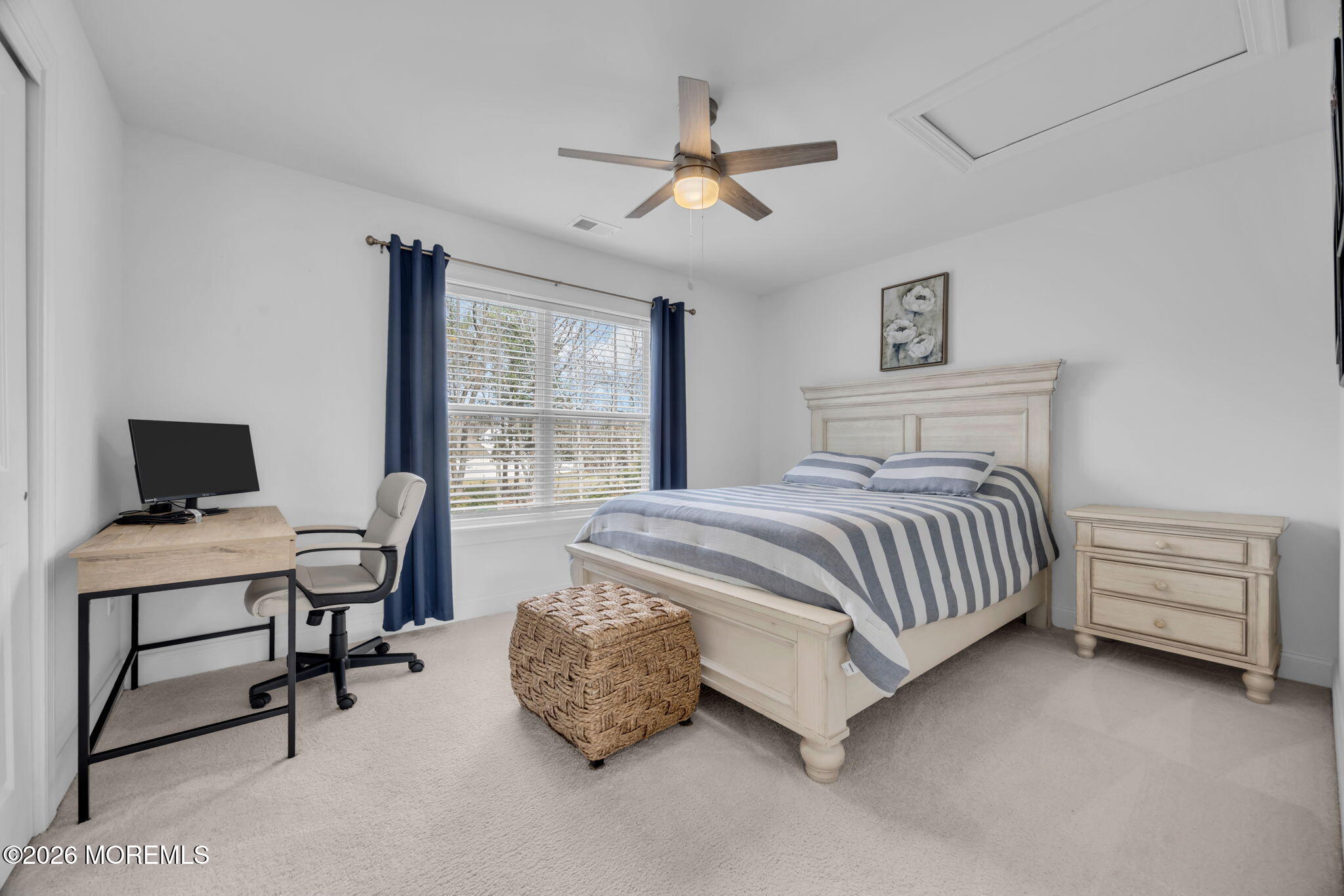 10 Tasha Lane Howell, NJ 07731 - Photo 36 of 44 a bedroom with a bed and a desk