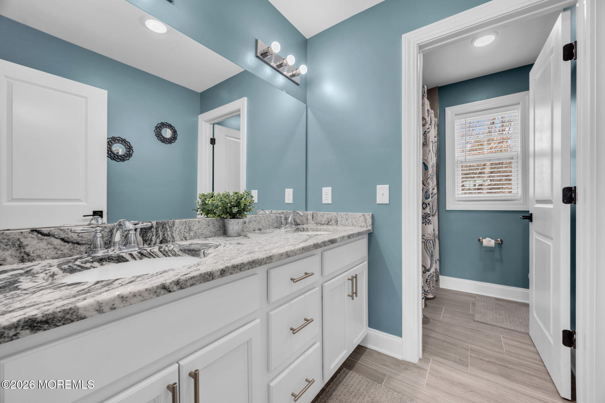 10 Tasha Lane Howell, NJ 07731 - Photo 37 of 44 a bathroom with a granite countertop sink and a mirror