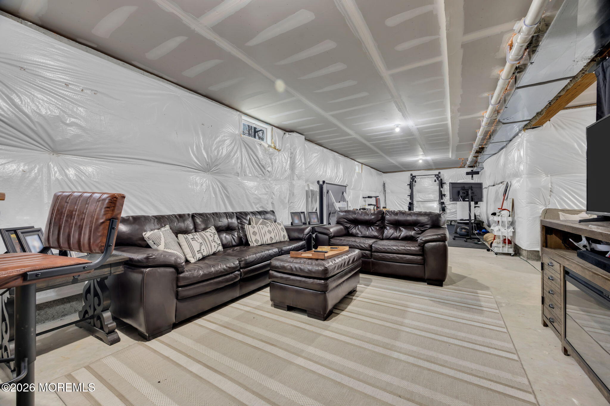 10 Tasha Lane Howell, NJ 07731 - Photo 38 of 44 a living room with furniture kitchen view and a couch