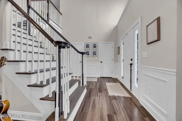 a view of entryway with wooden floor
