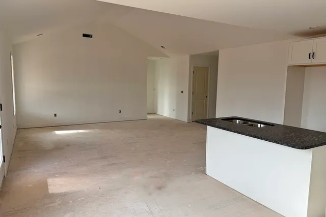 a living room with hard wood floors