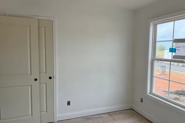 an empty room with windows