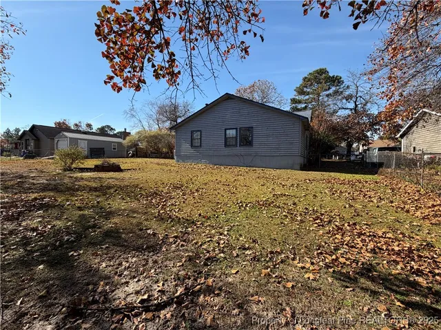 a view of a yard with a house