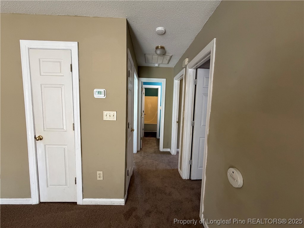 52 Montana Lane Spring Lake, NC 28390 - Photo 7 of 18 a view of a hallway with wooden floor and closet