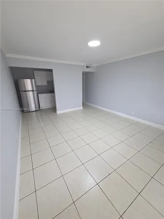 a view of an empty room and staircase