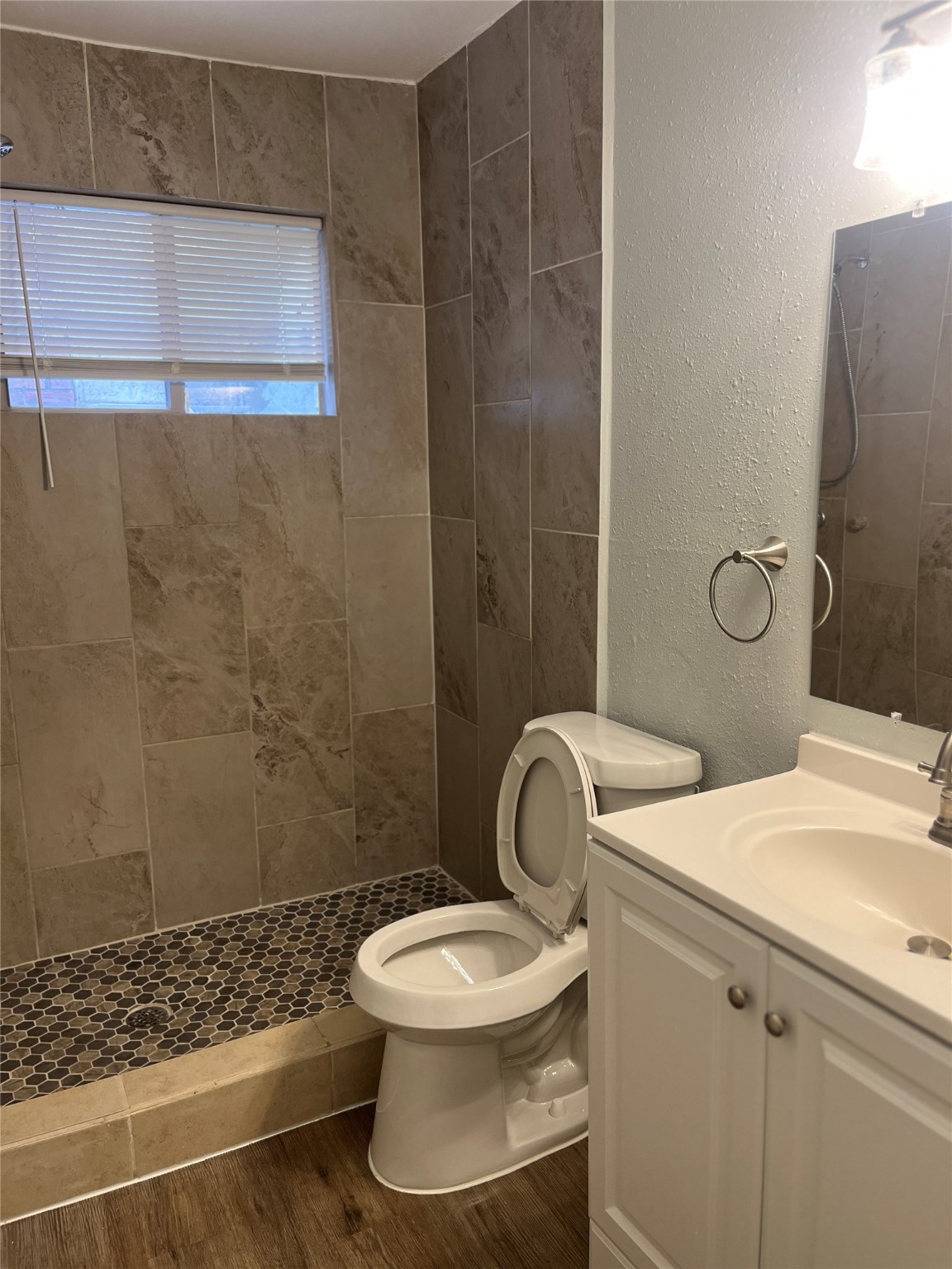 4624 Bell Street, Unit 2 Houston, TX 77023 - Photo 11 of 12 a bathroom with a sink toilet and shower