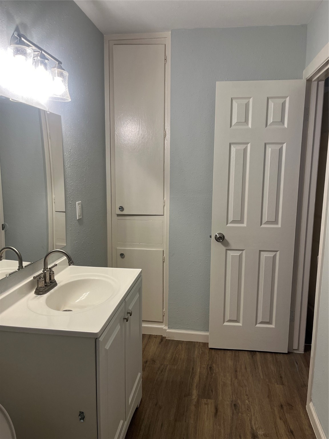 4624 Bell Street, Unit 2 Houston, TX 77023 - Photo 12 of 12 a bathroom with a sink and a mirror