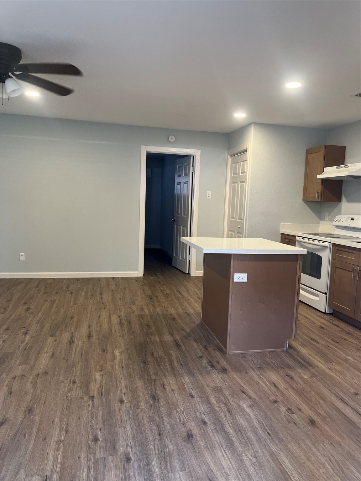 4624 Bell Street, Unit 2 Houston, TX 77023 - Photo 5 of 12 a view of kitchen with stainless steel appliances granite countertop cabinets and wooden floor