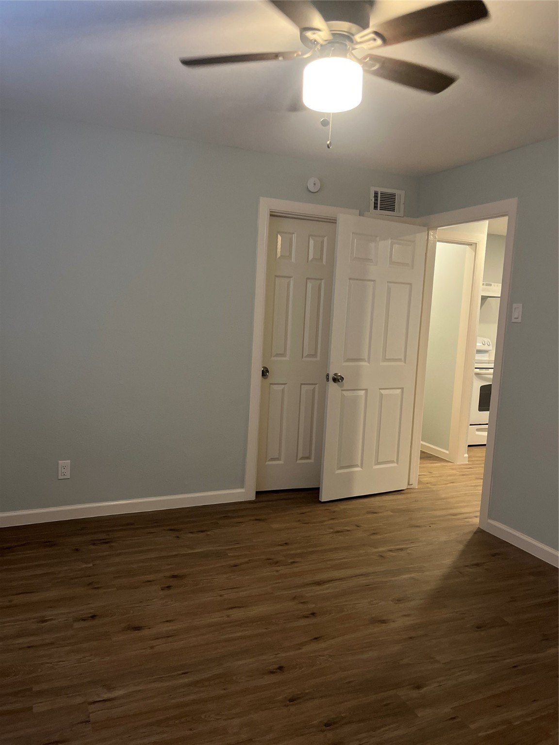 4624 Bell Street, Unit 2 Houston, TX 77023 - Photo 9 of 12 a view of an empty room with wooden floor