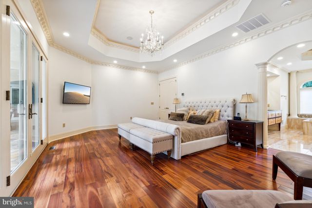 a large spacious bathroom with a large tub and window