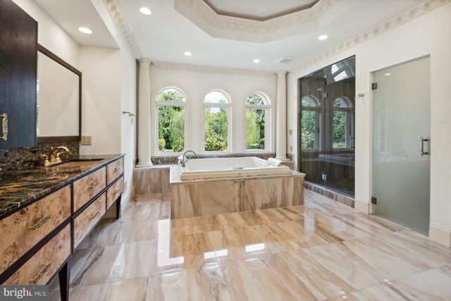 a spacious bathroom with a double vanity sink and a mirror