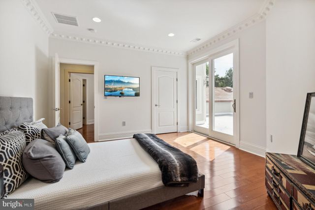 a view of a balcony with potted plants