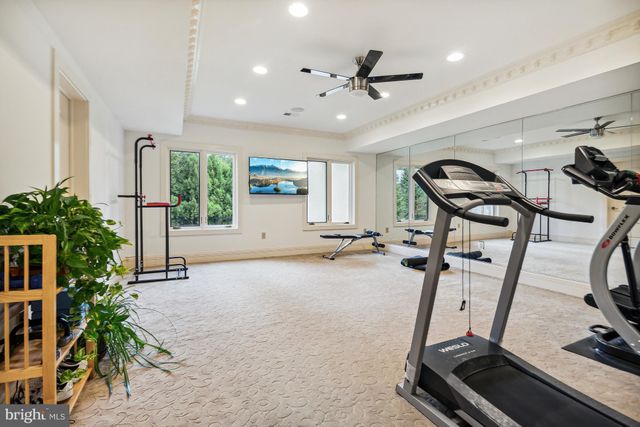 a front view of a house with wooden floor and chair