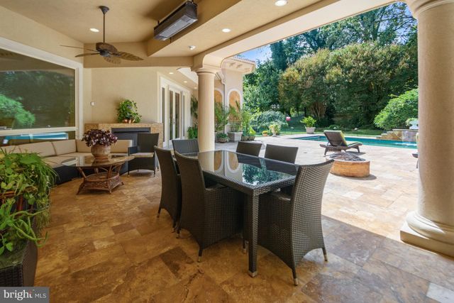 a view of a backyard with a sitting area and slide