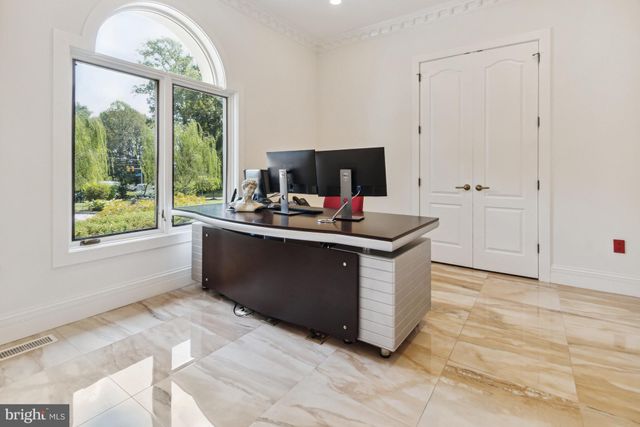 a living room with kitchen furniture and a fireplace