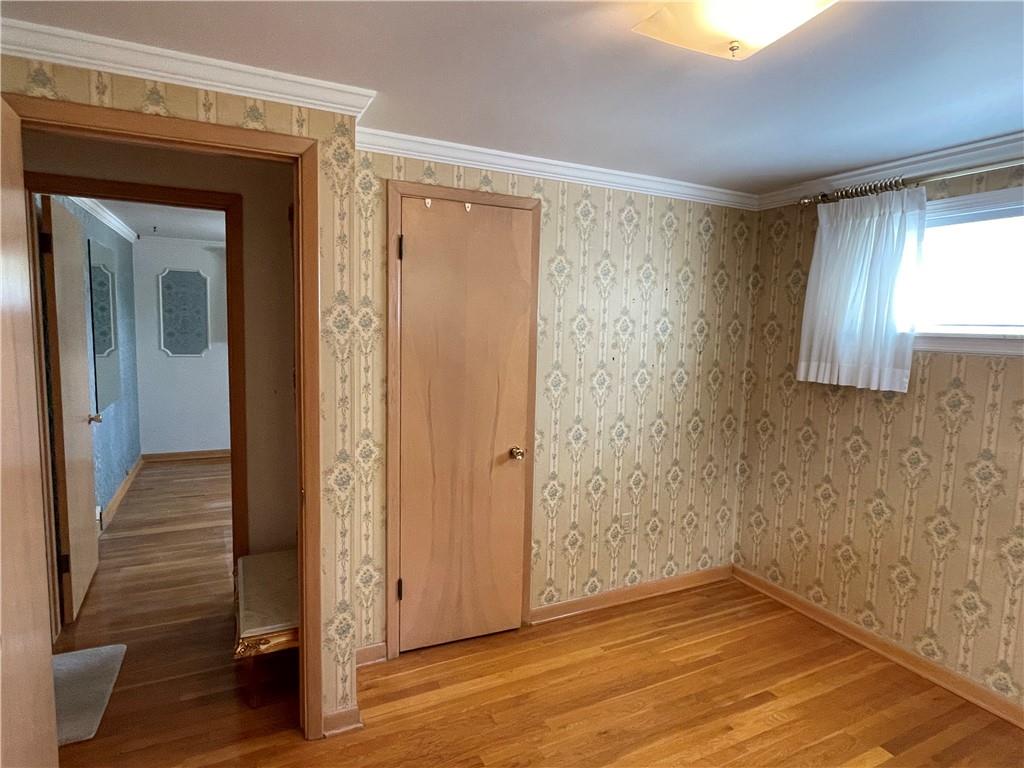 2310 North Forest Grove Road Coraopolis, PA 15108 - Photo 23 of 50 a view of an empty room with wooden floor and a window