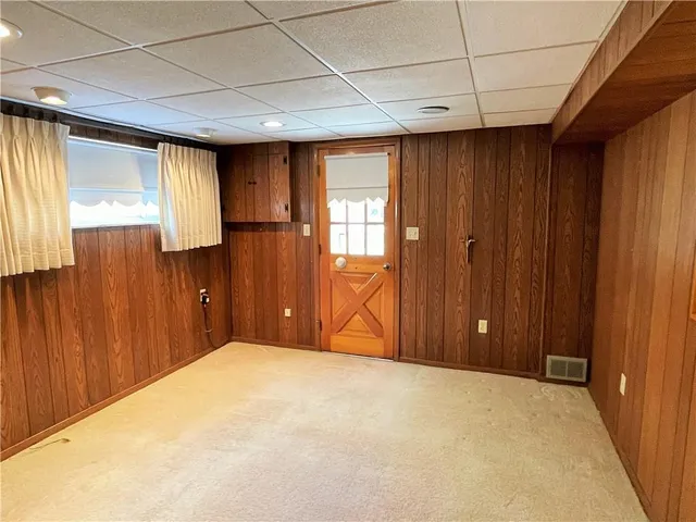 a view of a hallway with seating area