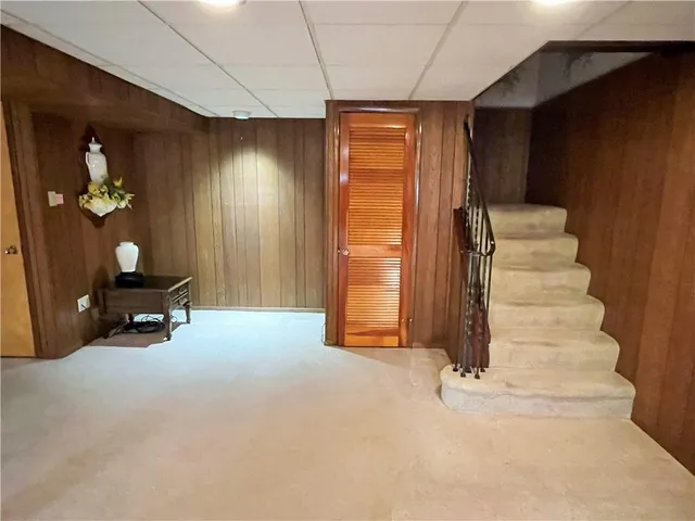 a view of a room with gym equipment and a window