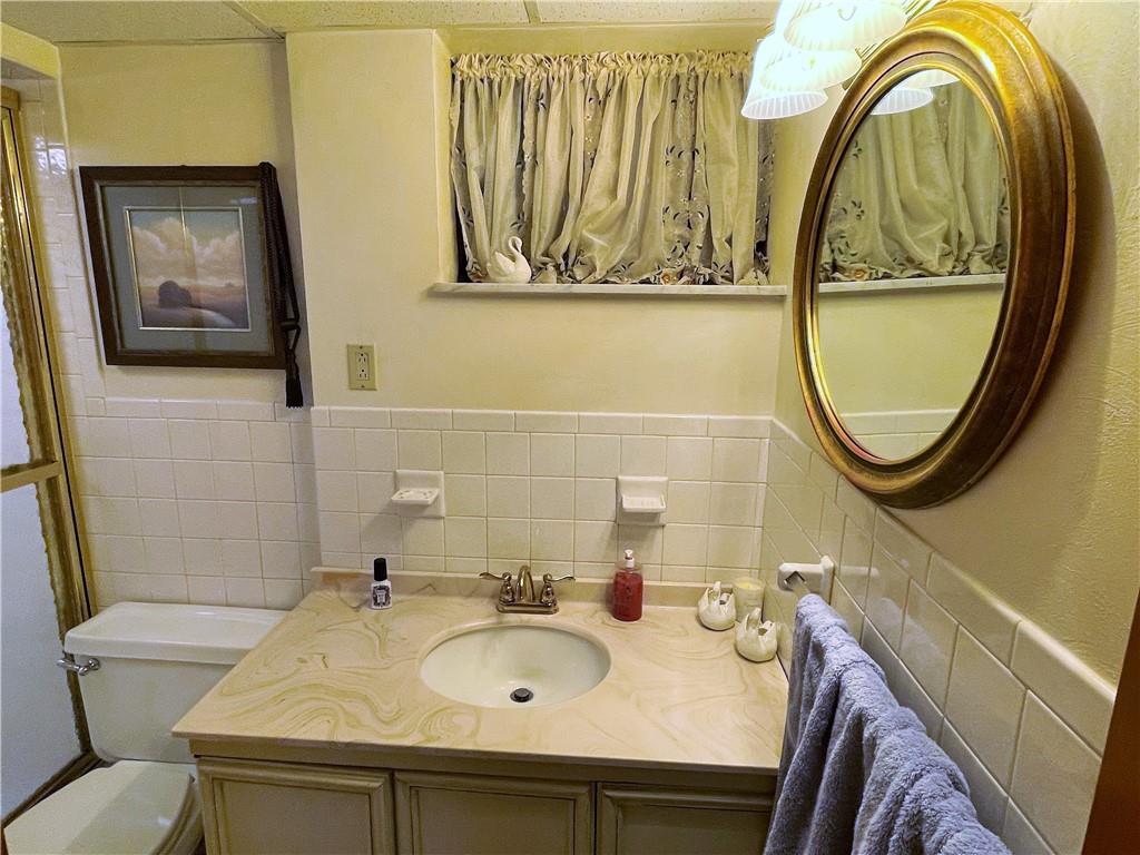2310 North Forest Grove Road Coraopolis, PA 15108 - Photo 33 of 50 a bathroom with a sink and a mirror