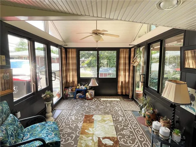 a living room with large windows