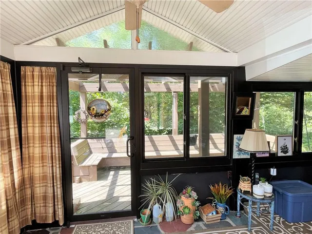 a view of a chairs and tables in the balcony