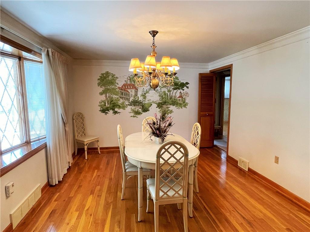 2310 North Forest Grove Road Coraopolis, PA 15108 - Photo 8 of 50 a view of a dining room with furniture window and wooden floor