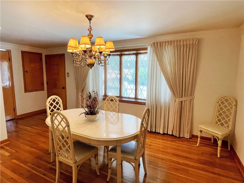 2310 North Forest Grove Road Coraopolis, PA 15108 - Photo 9 of 50 a view of a dining room with furniture window and wooden floor