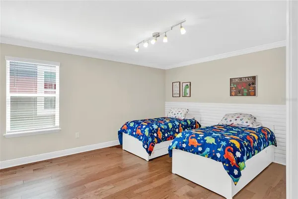 a bedroom with bed and a window