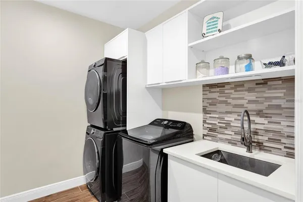 a bathroom with a sink toilet and mirror