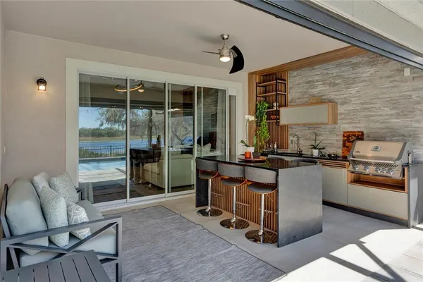 a view of swimming pool with outdoor seating