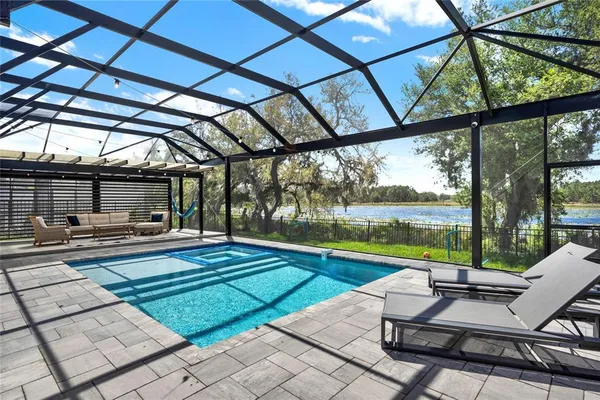 a view of a swimming pool with a patio