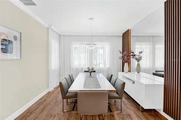 a dining room with furniture and window