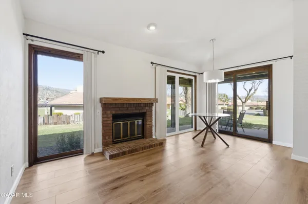 a view of a livingroom with furniture and a fireplace