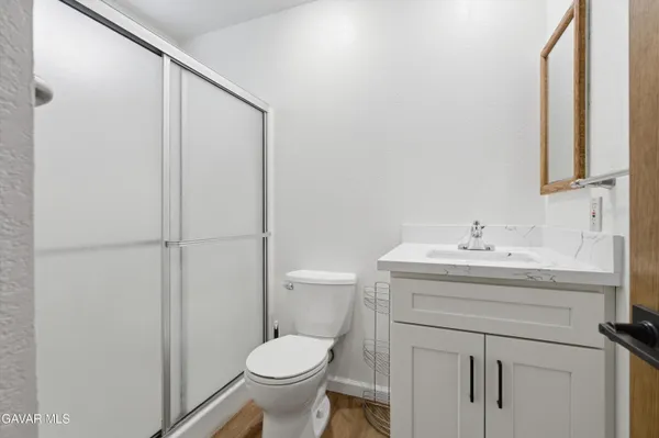 a bathroom with a sink toilet and vanity