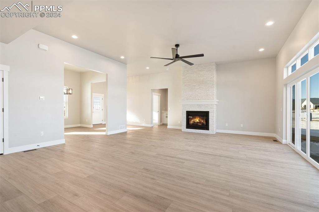 17615 Blacksmith Drive Peyton, CO 80831 - Photo 15 of 41 an empty room with windows and fireplace
