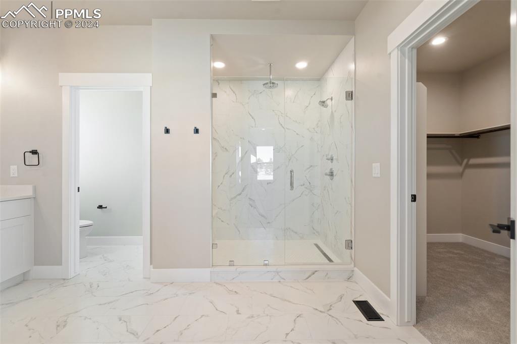 17615 Blacksmith Drive Peyton, CO 80831 - Photo 22 of 41 a view of a bathroom with a shower and a sink