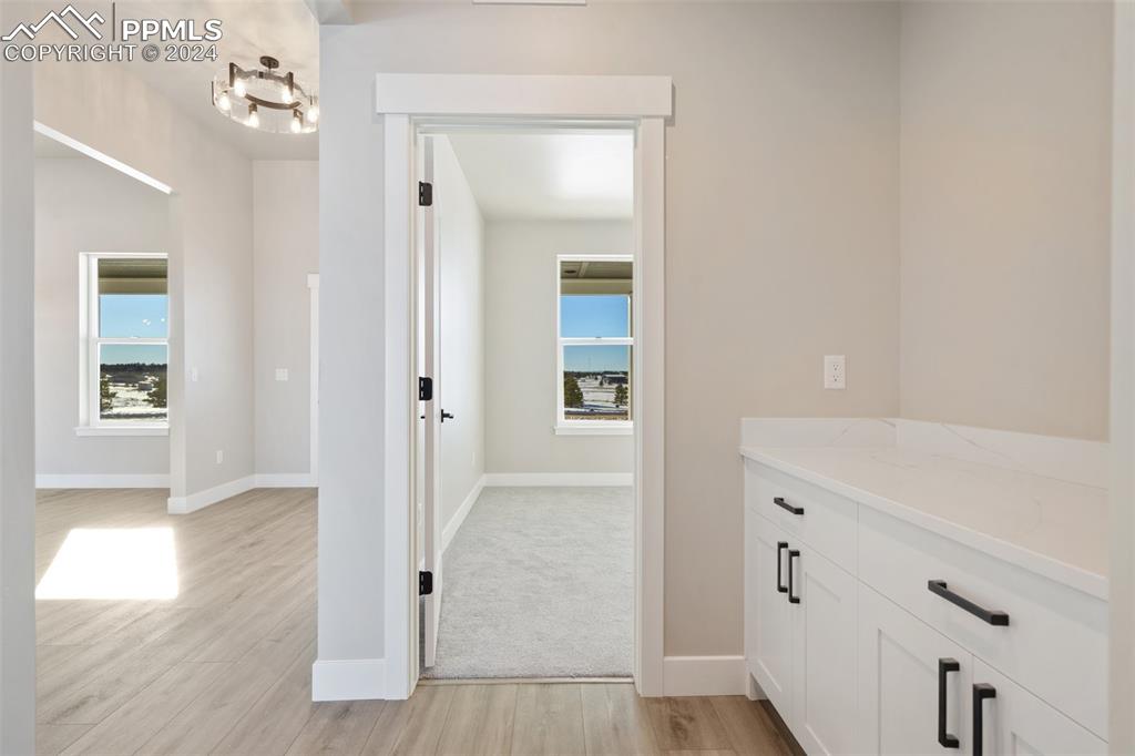 17615 Blacksmith Drive Peyton, CO 80831 - Photo 28 of 41 wooden floor with white walls