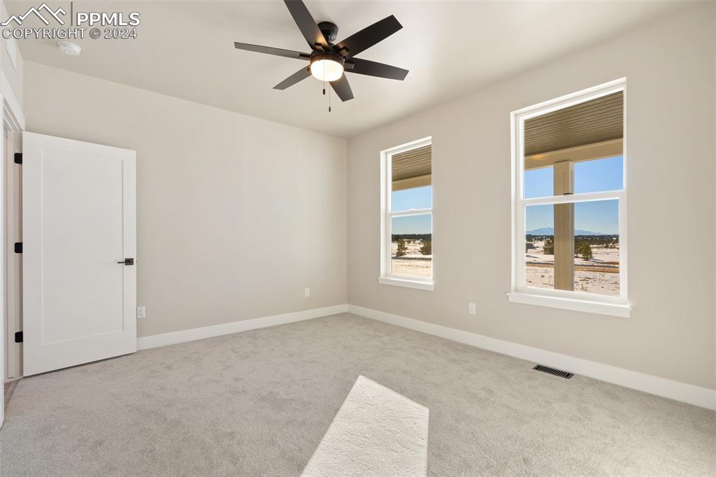 17615 Blacksmith Drive Peyton, CO 80831 - Photo 33 of 41 a view of an empty room with a window