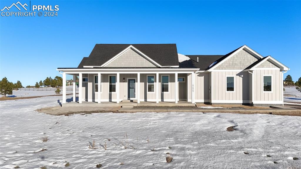 17615 Blacksmith Drive Peyton, CO 80831 - Photo 4 of 41 a front view of a house with a garden