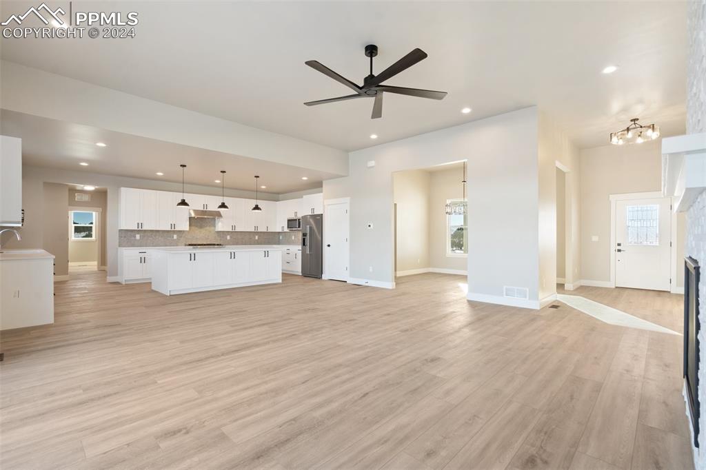 17615 Blacksmith Drive Peyton, CO 80831 - Photo 9 of 41 a view of a kitchen with a refrigerator a sink and a stove